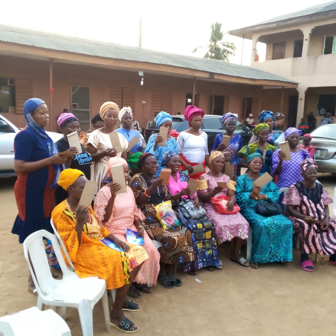 Widows of the foundation gathered together, holding gifts of encouragement